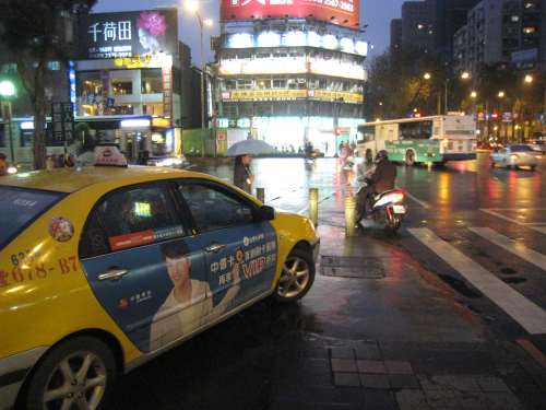A Taipei taxi driving down the sidewalk